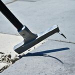 how to remove wrought iron railing from concrete